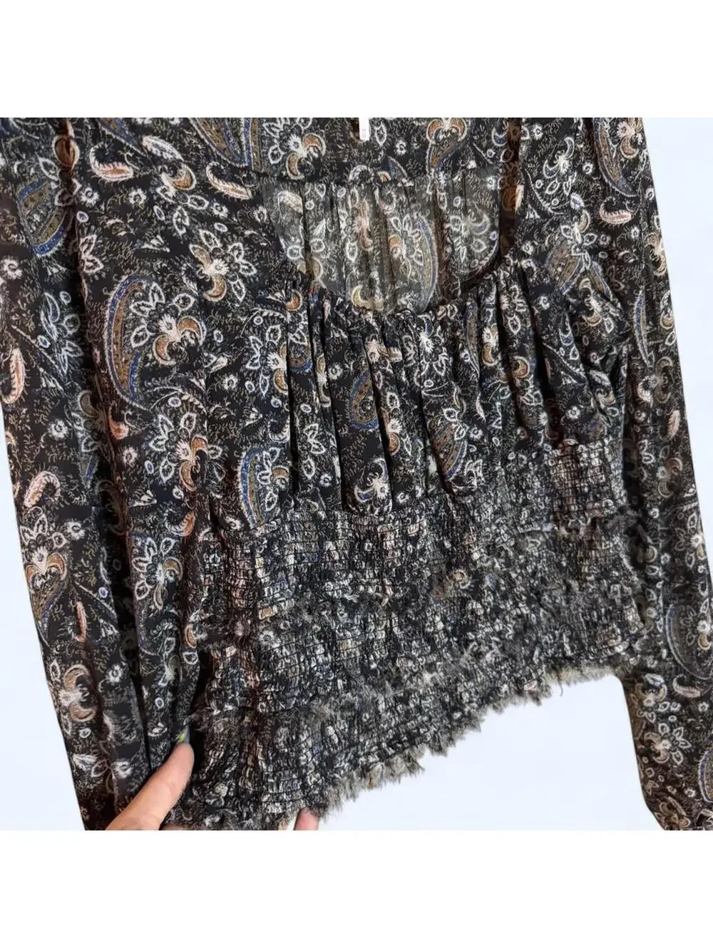 Black and grey paisley print blouse with long sleeves and ruffled hem